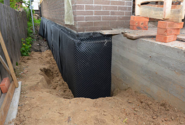 Happy homeowners after waterproofing job in Chaptico
